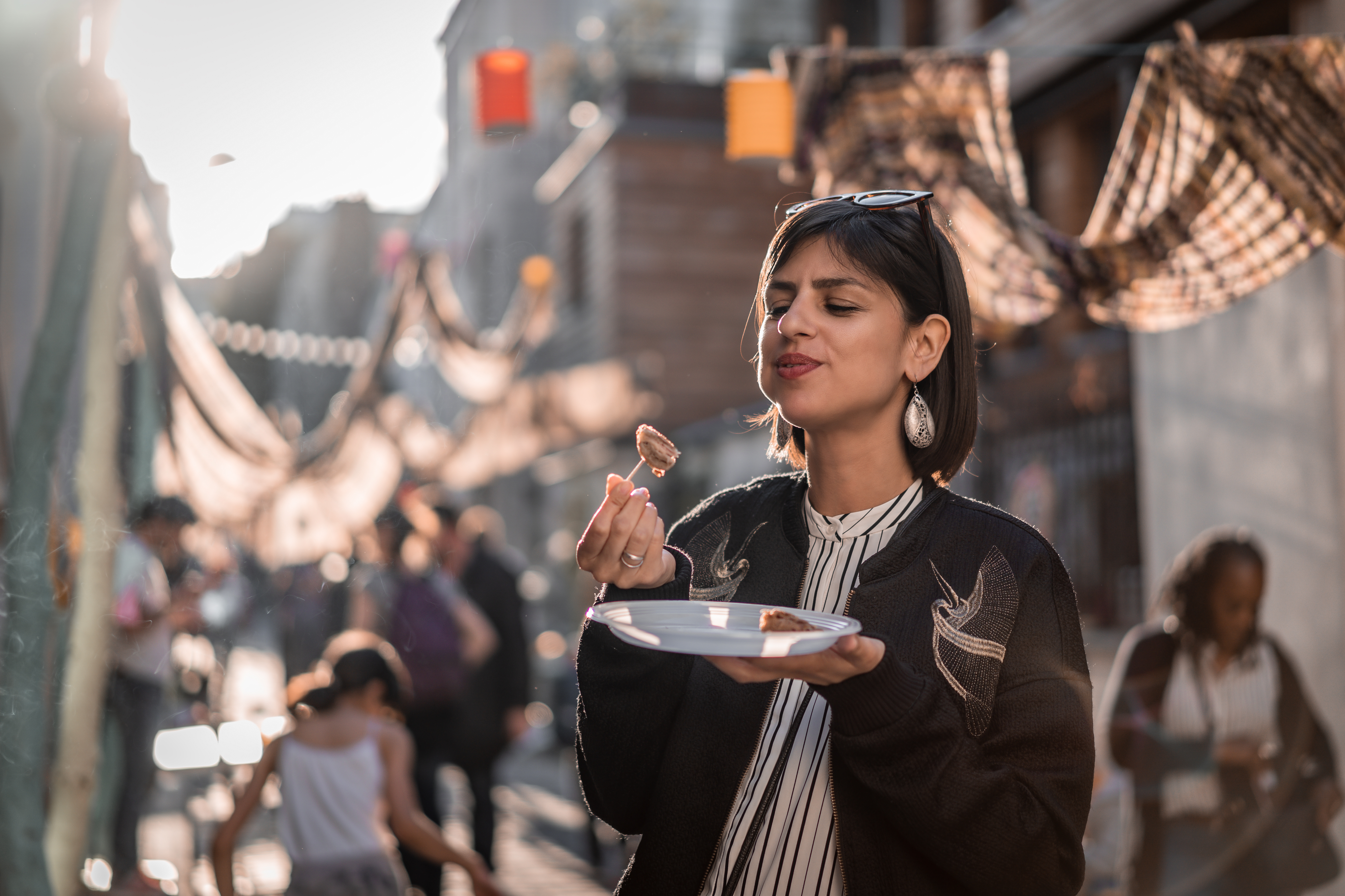 Young female tourist in Paris eating street food