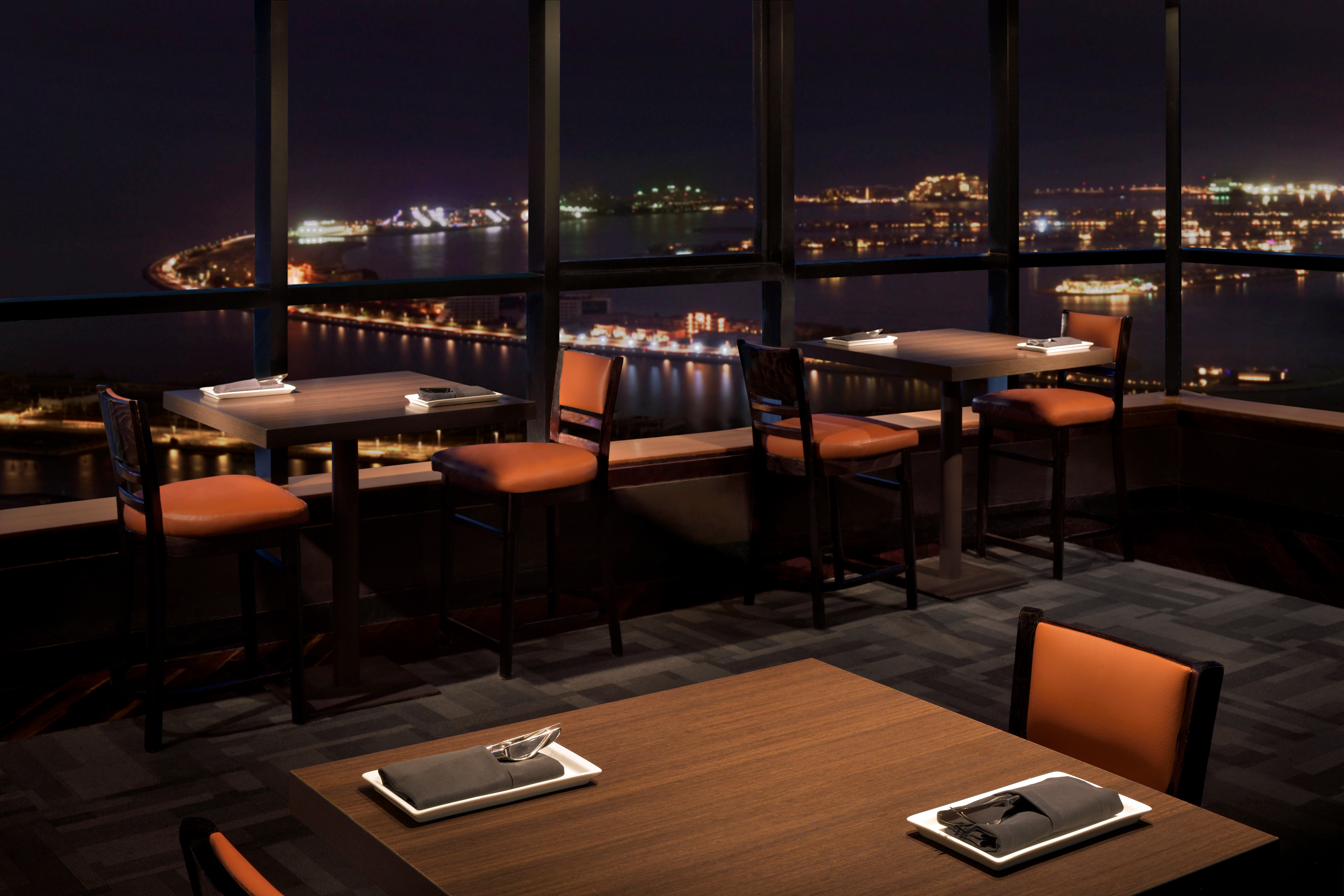 Dining tables with evening city view