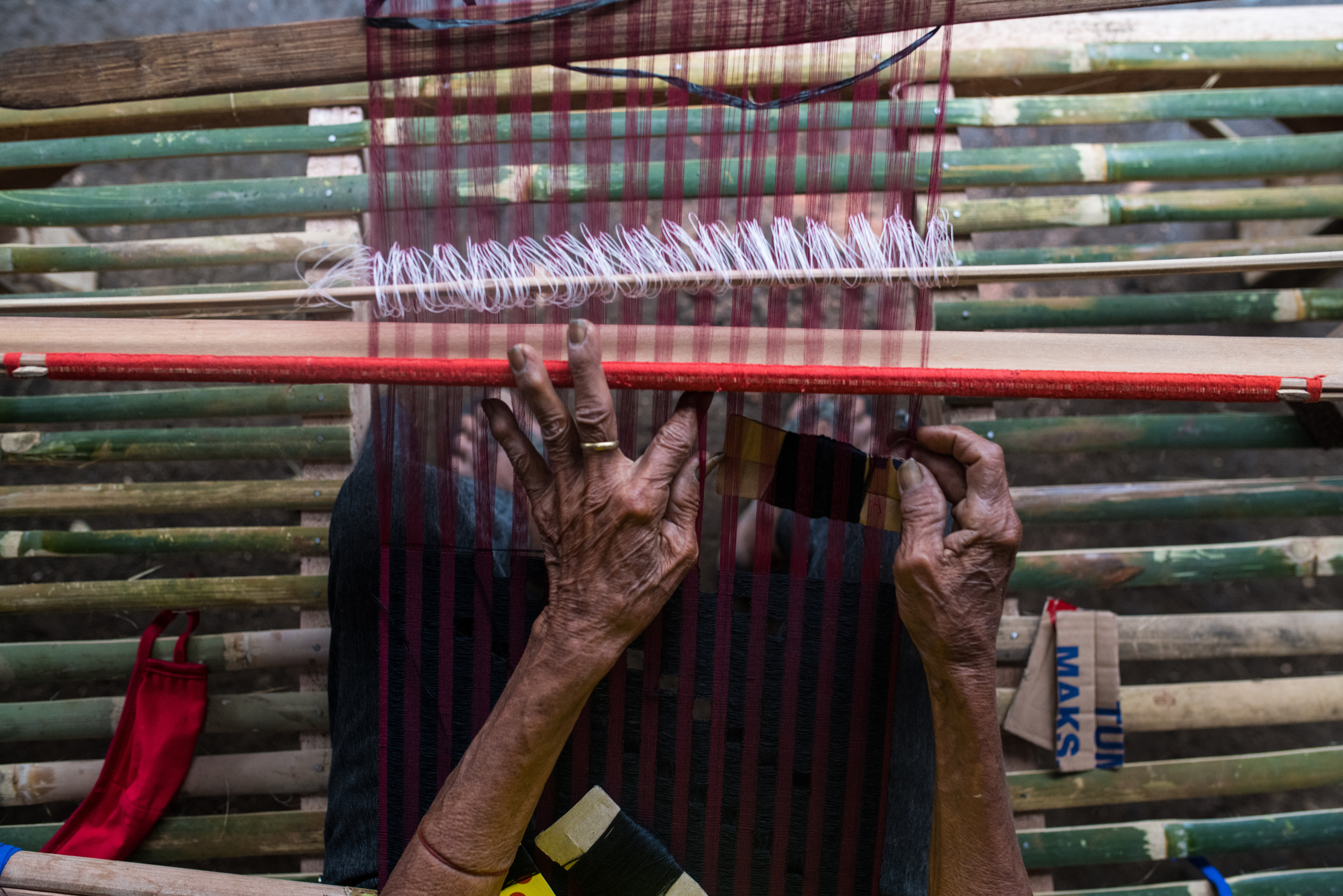 Person at Loom Weaving