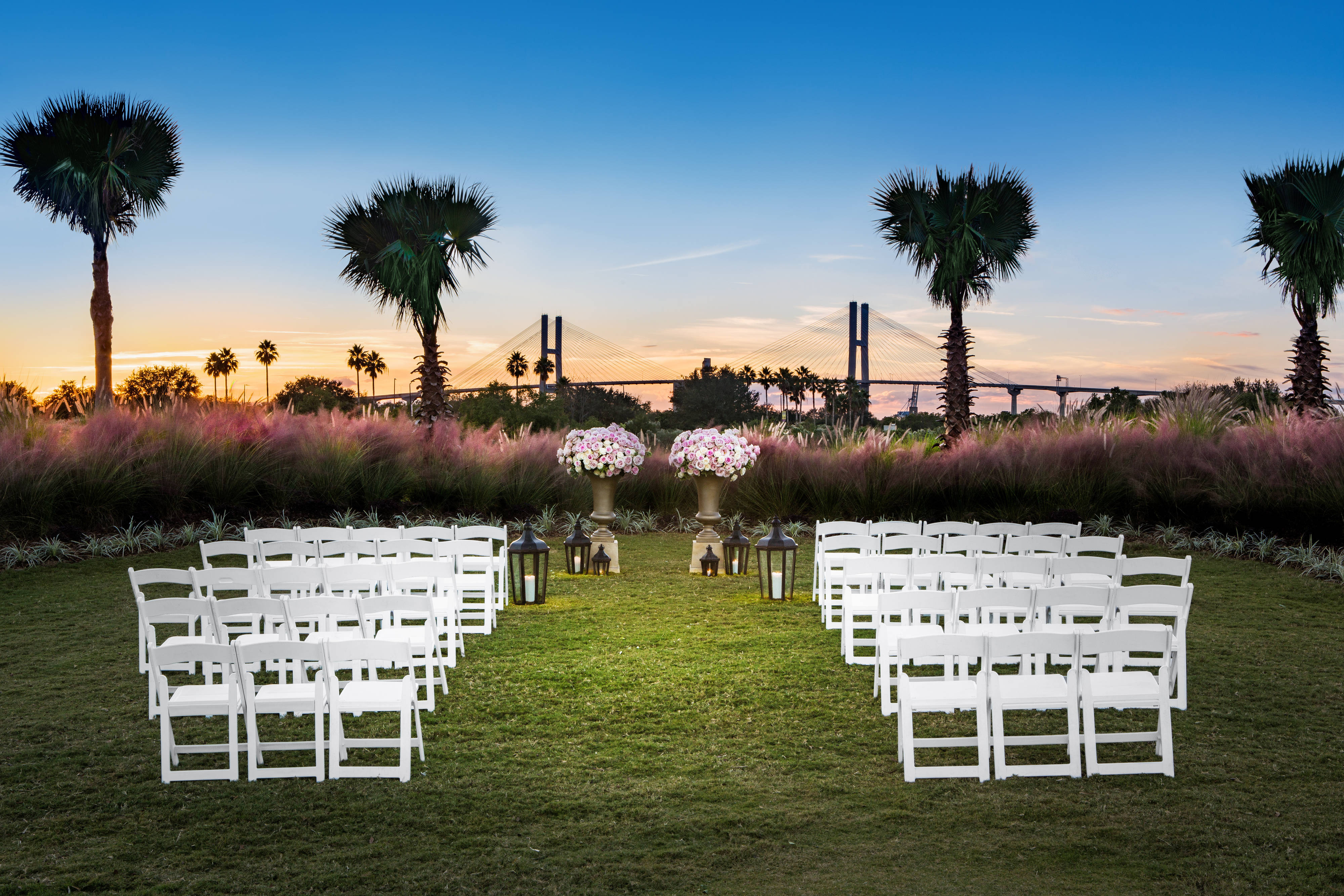 Landscaped Club Lawn with view of bridge set for intimate wedding
